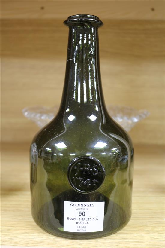 A cut glass bowl, two salts and a wine bottle, bottle height 23cm